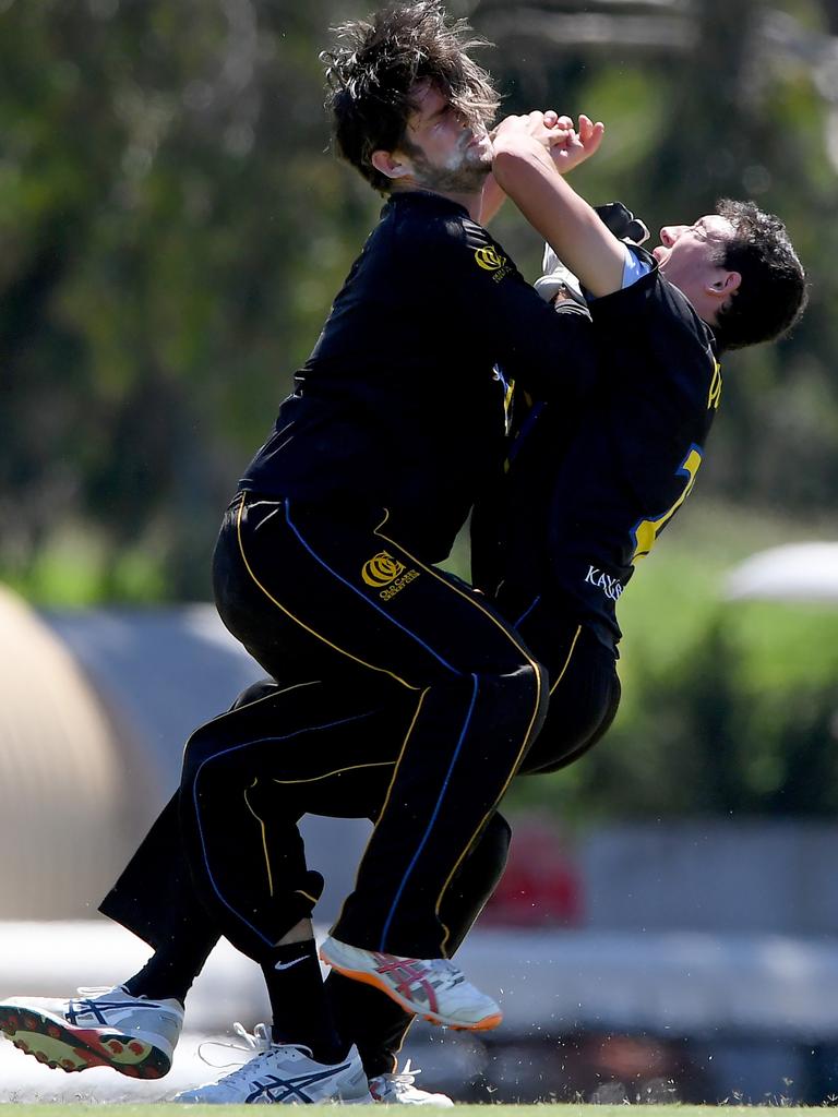 ECA - Old Carey pair Josh Devine and Jack Quartermain collide while attempting a catch. Picture: Andy Brownbill