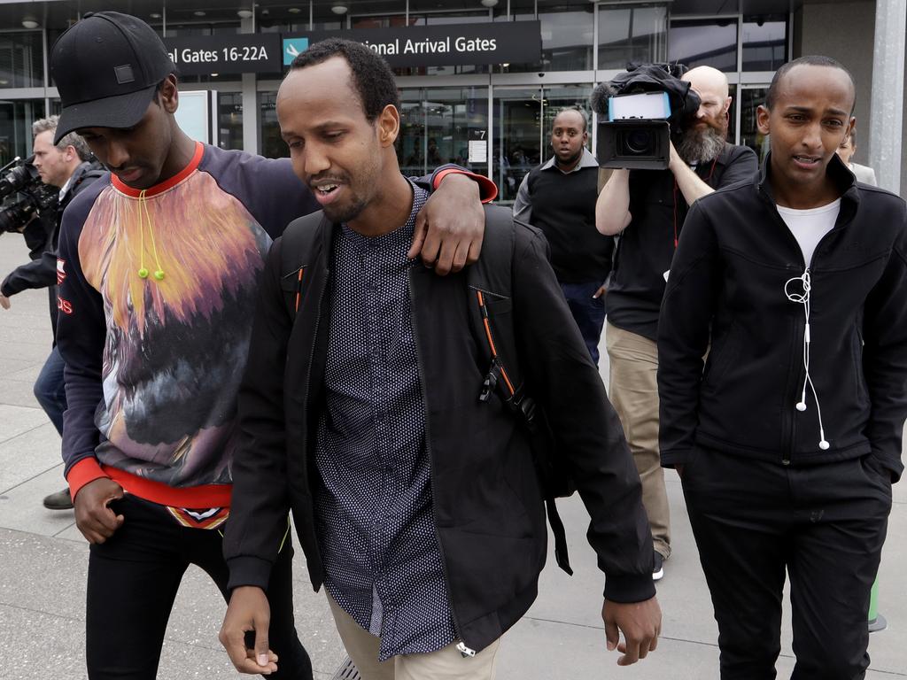 Abdifatah Ibrahim and his brother Abdi, right, walk with an unidentified friend in Christchurch, New Zealand. Picture: AP