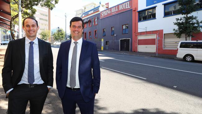 Cushman &amp; Wakefield’s Michael and Andrew Gard in front of the old Spring Hill pub they sold for $6.5m.