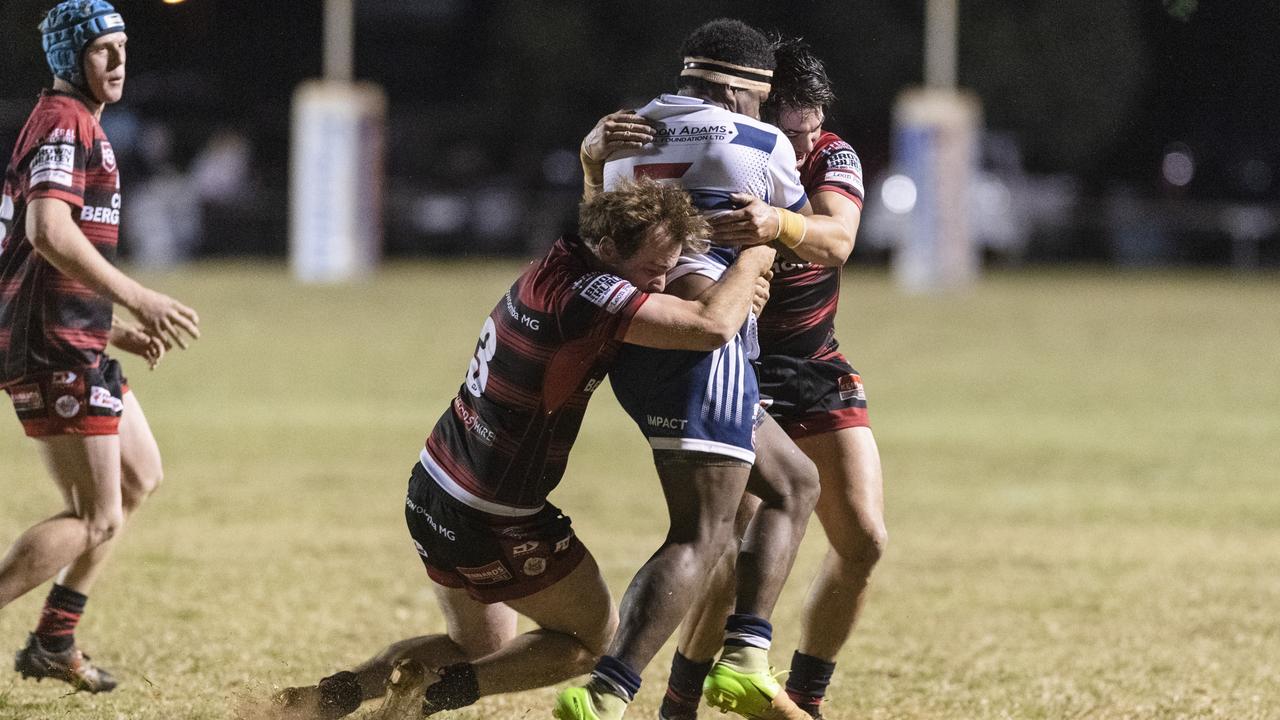 Valleys players Jackson Shelswell (left) and Daniel Bain wrap up Eliki Rabisi of Brothers. Picture: Kevin Farmer