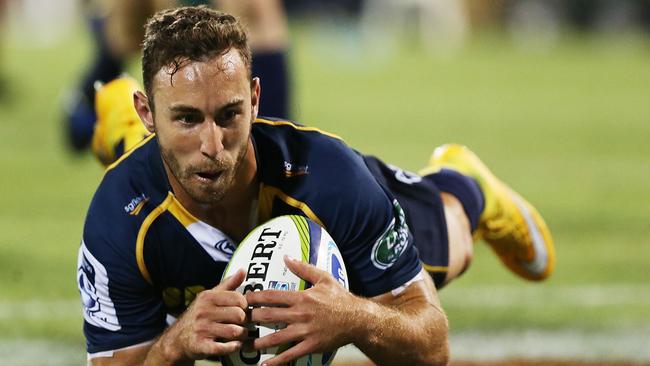 CANBERRA, AUSTRALIA - FEBRUARY 13: Nic White of the Brumbies scores a try during the round one Super Rugby match between the Brumbies and the Reds at GIO Stadium on February 13, 2015 in Canberra, Australia. (Photo by Stefan Postles/Getty Images)