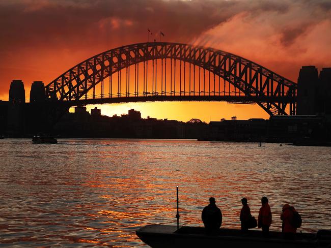 The Daily Telegraph 5.5.2025 Sunrise over the Sydney Harbour Bridge, pictured from Looks Avenue in Balmain. Picture: Rohan Kelly