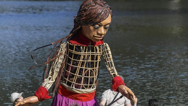 ADELAIDE, AUSTRALIA - NewsWire Photos MARCH 15 2024:  Little Amal puppet arrives in Adelaide.  Little Amal arrives by boat on the river Torrens.Picture: NCA NewsWire / RoyVphotography