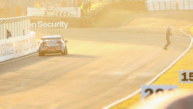 Jamie Whincup walks away from his car after running out of fuel on the last lap of the Bathurst 1000. Picture: Getty Images