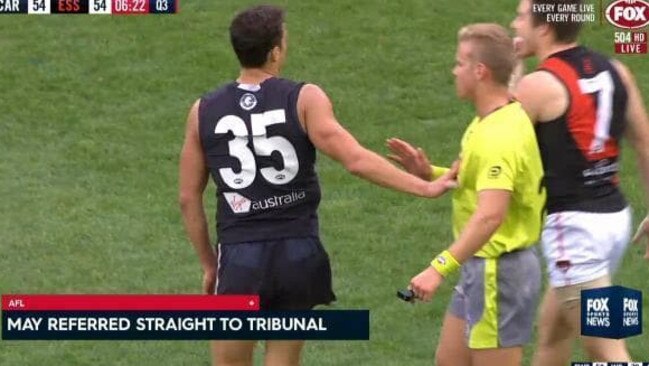 AFL screen shot of Ed Curnow touching an umpire.