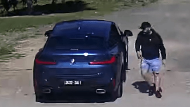 CCTV footage also captured the pair fleeing in a dark blue BMW X4, which police believe was stolen. Picture: Victoria Police