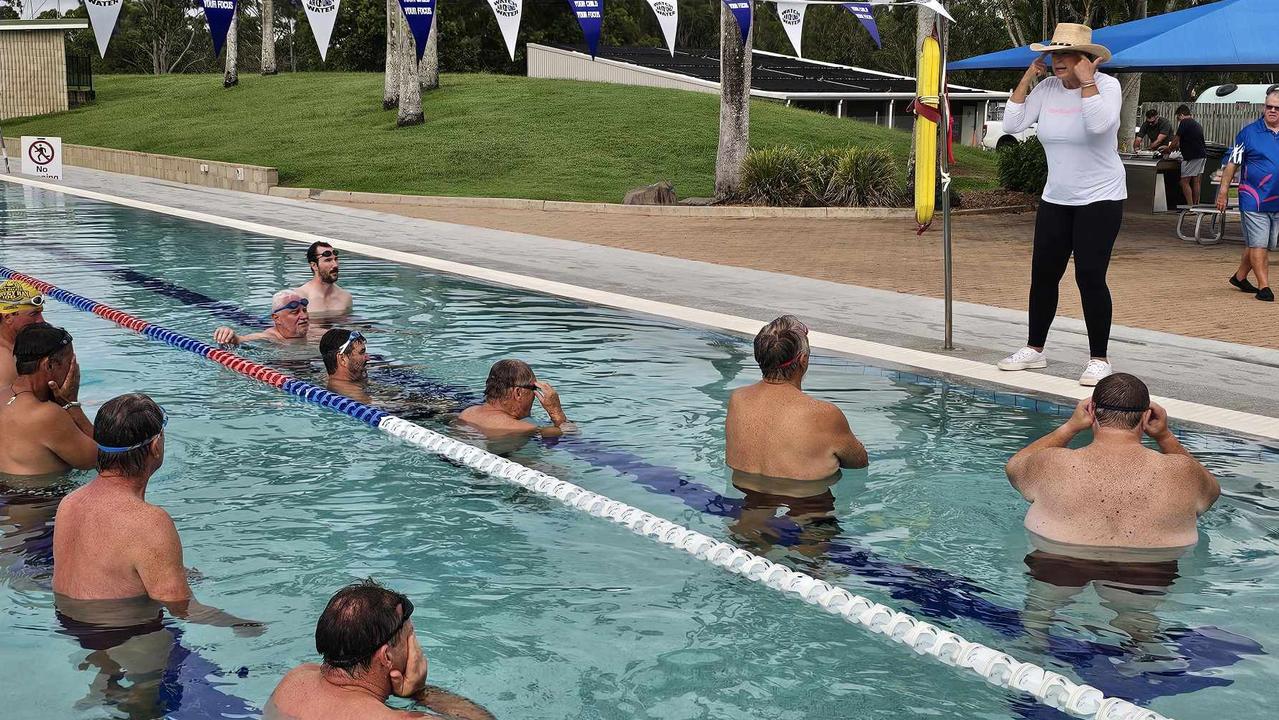 Swimming champion Lisa Curry meets with members of Fraser Coast Mates amid her campaign to make men better swimmers.