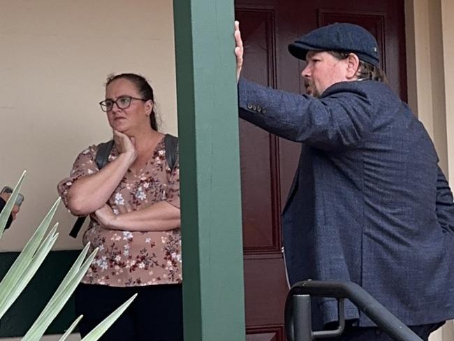 Rebecca and Robert Allan with their defence attorney outside Ballina Local Court on Monday.