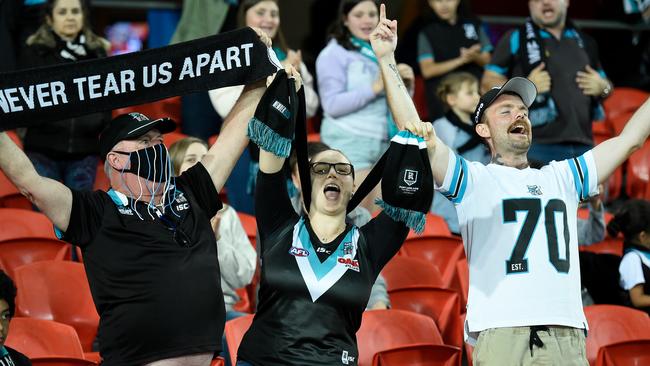 Port Adelaide fans celebrating the Power’s win over North Melbourne on Saturday night. Picture: Matt Roberts (Getty).