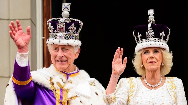 King Charles III and Queen Camilla wave to the crowds from the balcony of Buckingham Palace after their Coronation. Picture: Leon Neal/Getty Images