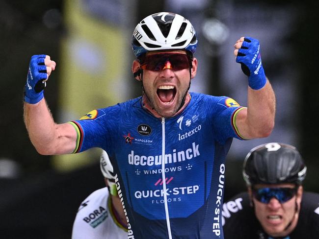 TOPSHOT - Stage winner Team Deceuninck Quickstep's Mark Cavendish of Great Britain celebrates as he crosses the finish line of the 4th stage of the 108th edition of the Tour de France cycling race, 150 km between Redon and Fougeres, on June 29, 2021. (Photo by Anne-Christine POUJOULAT / POOL / AFP)