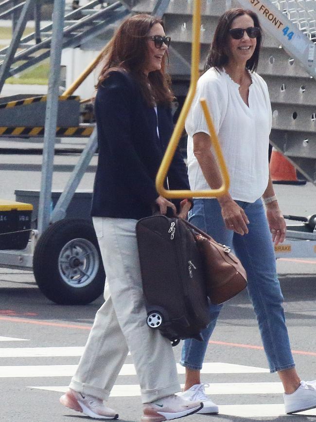 Greeted by her sister (right) at Hobart airport. Picture: David Killick