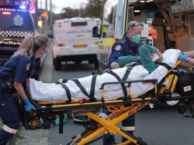 A manhuntÃis underway after a man stumbled into traffic bleeding from a stab wound to the neck this afternoon in SydneyÃs east.ÃThe man believed to be in his 30s was found at Anzac Pde, Maroubra at 4.30pm by two off-duty paramedics who worked to keep the man alive before an ambulance arrived. People rushed from their cars to try and help the man, who collapsed in the middle of the busy street. Picture TNV