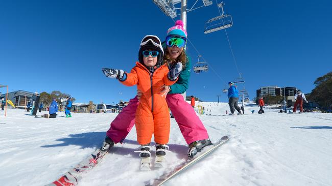 Mum Jenny and son Finley enjoyed a sunny day on Bourke St under the new Bourke St Express Chair lift at the resort’s early opening weekend. Picture: Andrew Railton.