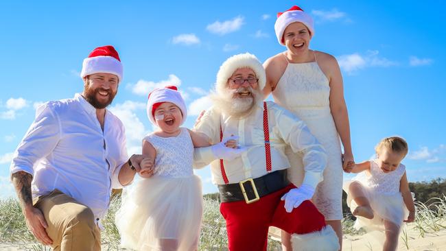 Paige Skarratts with parents Jake and Tania, sister Imogen and Santa. Photo: Naturally Creative Photography