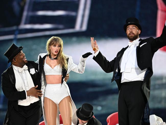 LONDON, ENGLAND - JUNE 23: (EDITORIAL USE ONLY. NO BOOK COVERS) EXCLUSIVE ACCESS. Taylor Swift is joined on stage by Travis Kelce (R), during "Taylor Swift | The Eras Tour" at Wembley Stadium on June 23, 2024 in London, England. (Photo by Gareth Cattermole/TAS24/Getty Images for TAS Rights Management )