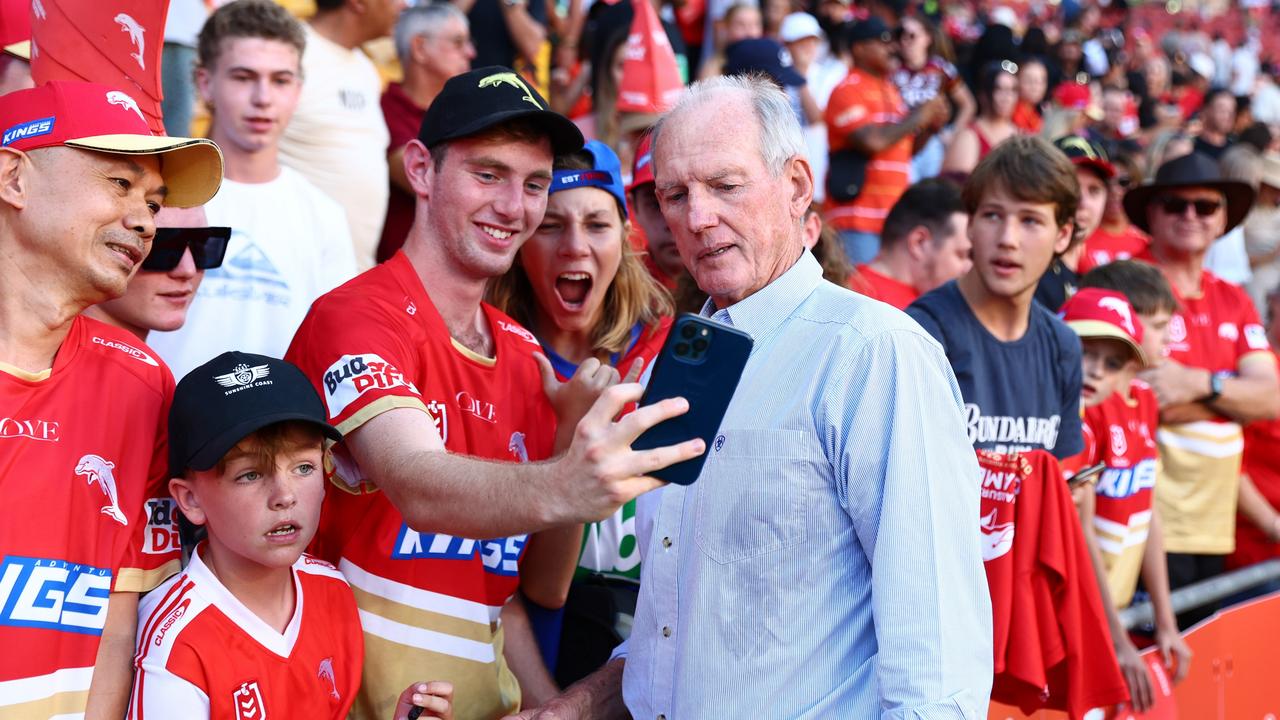 Dolphins coach Wayne Bennett poses with fans after the round one win over the Roosters. Picture: Getty Images