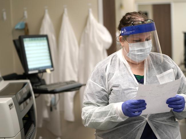 A medical technologist in the US looks over test results from a COVID-19 antibody test. Picture: AP