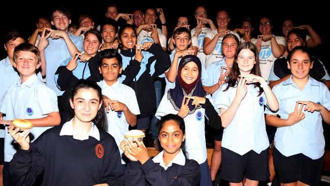 Riverstone High School celebrates Pi Day, with recital winner Rona Elaya first left in front row.