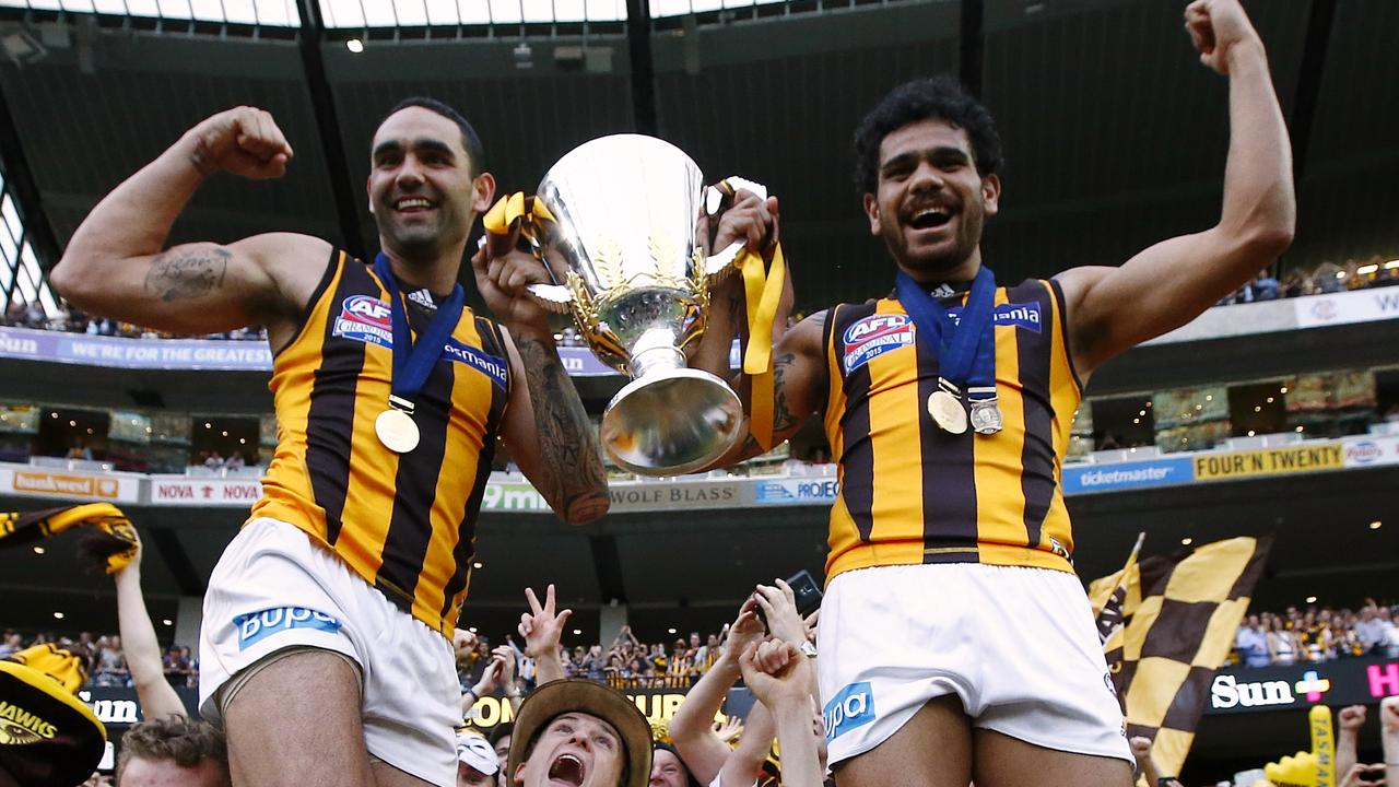 Burgoyne and Rioli with the 2015 premiership cup. Picture: Wayne Ludbey