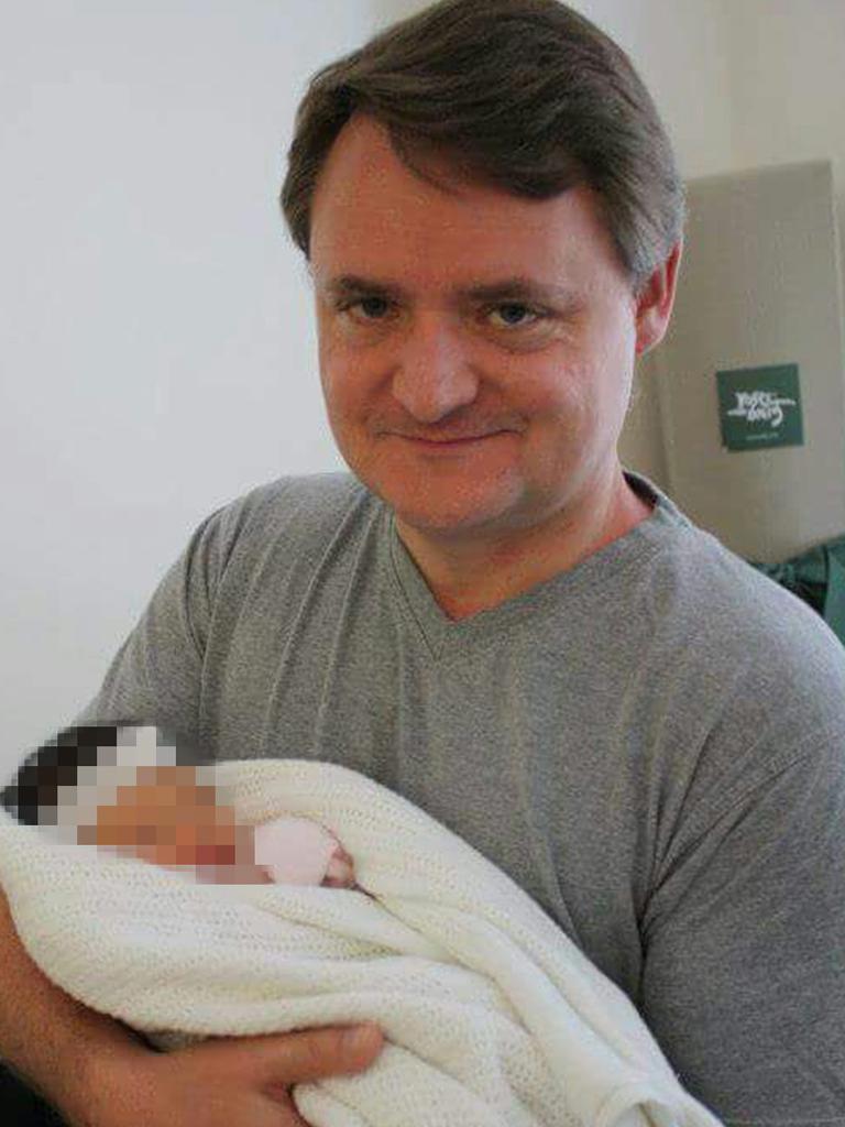 Fernando Manrique with one of his children.