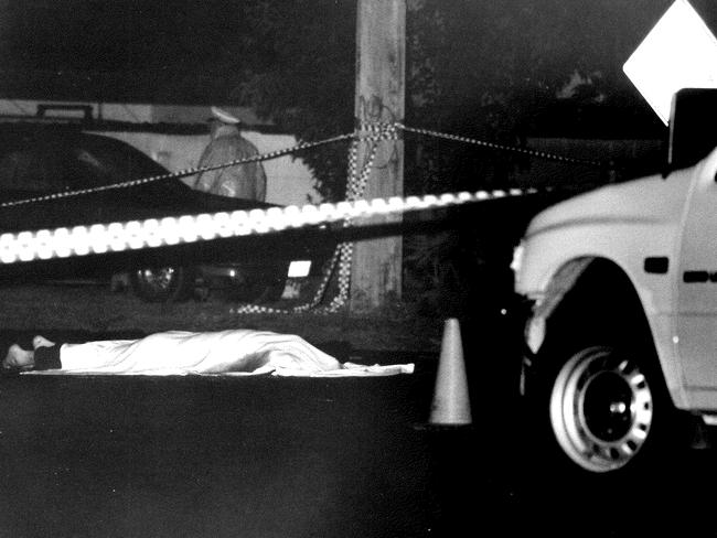 The body of Thomas Gannan under a blanket.