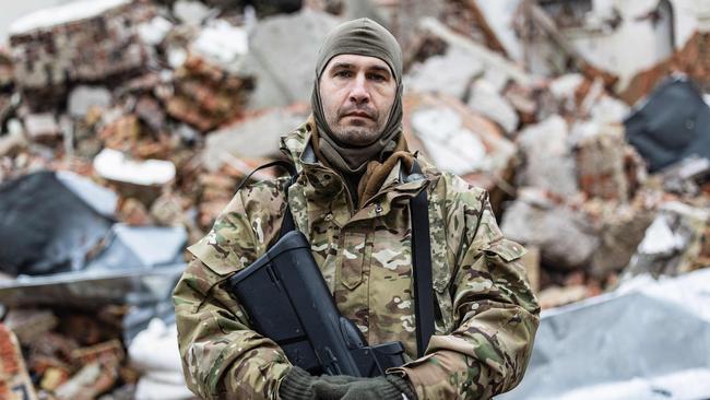 Caesar, 50-year-old, a Russian who joined the Freedom of Russia Legion to fight on the side of Ukraine, poses for a photograph in Dolyna.