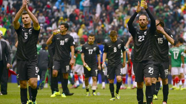 New Zealand players leave the pitch after losing to Mexico in 2013.