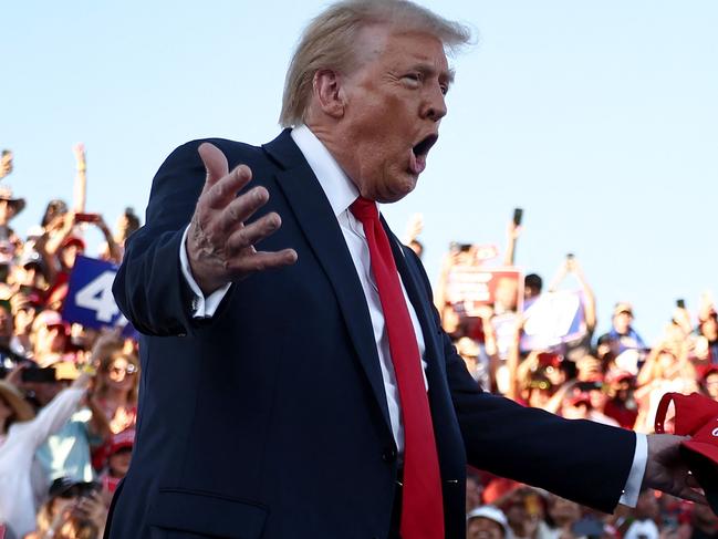 COACHELLA, CALIFORNIA - OCTOBER 12: Republican presidential nominee, former U.S. President Donald Trump gestures as he walks onstage for a campaign rally on October 12, 2024 in Coachella, California. With 24 days to go until election day, former President Donald Trump is detouring from swing states to hold the rally in Democratic presidential nominee, Vice President Kamala Harris' home state.   Mario Tama/Getty Images/AFP (Photo by MARIO TAMA / GETTY IMAGES NORTH AMERICA / Getty Images via AFP)