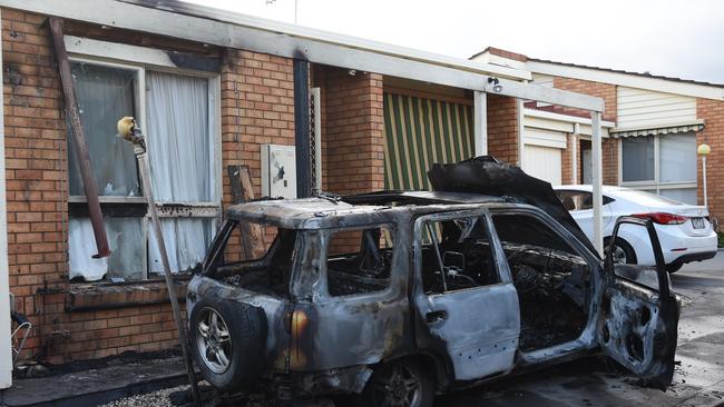 The burnt-out car outside the damaged unit. Picture: Nicole Garmston