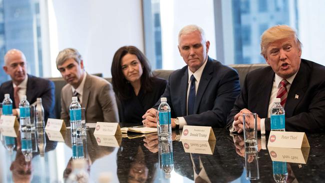 Jeff Bezos of Amazon, Larry Page of Alphabet Inc. (parent company of Google), Sheryl Sandberg of Facebook and Vice President Mike Pence listen as President Donald Trump speaks during a meeting with tech executives at Trump Tower. Picture: Drew Angerer