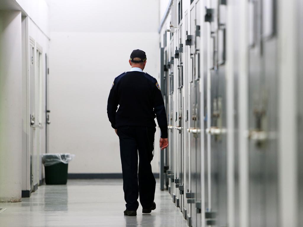 A Correctional Services officer walking down one of the cell blocks at Silverwater Correction Centre. Picture: Tim Hunter