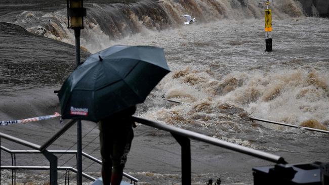 Heavy rain lashing the Parramatta River, causing the weir to overflow on March 20, 2021. Picture: Saeed Khan