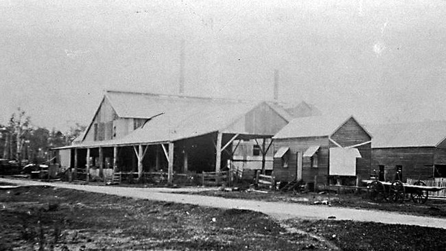 GCB PHOTO MUST CREDIT LOCAL STUDIES LIBRARY 7: Rocky Point Sugar Mill in the early 1930's during W. H. Heck's era [picture] / Photographer unknown.