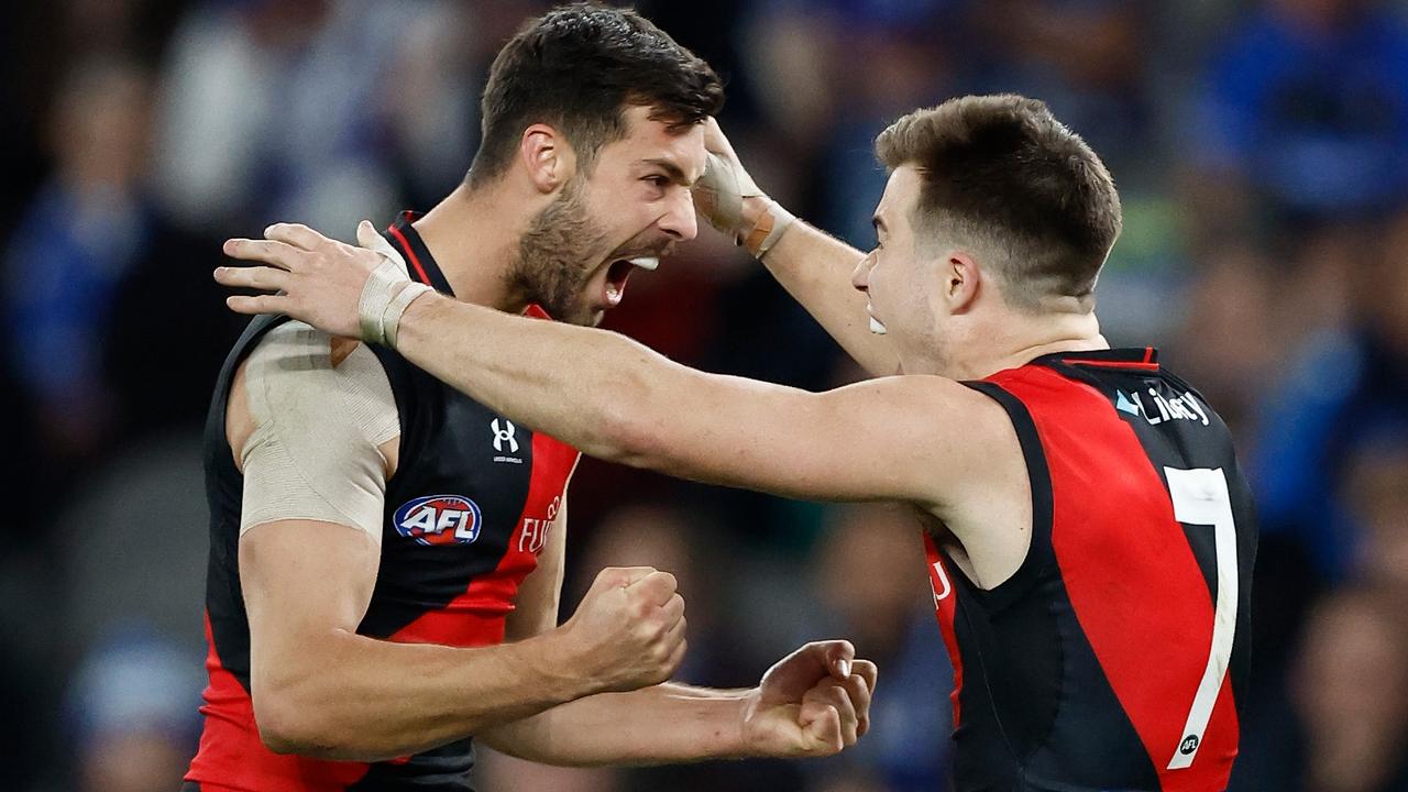 Kyle Langford and Zach Merrett of the Bombers celebrate during the Round 22 match against North Melbourne. Picture: Michael Willson/AFL Photos via Getty Images.