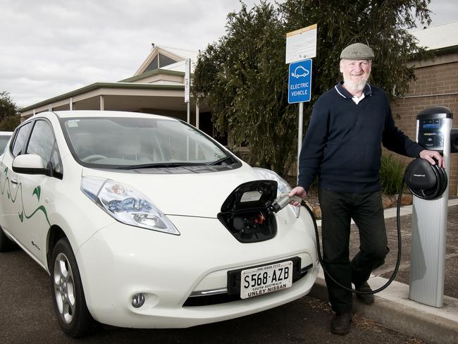 ECO-WISE: Tom Cousins charges an electric car at Kingscote Airport. Picture: Sean McGowan