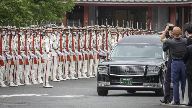 A hearse carrying the body of Shinzo Abe leaves Tokyo’s Zojoji temple on July 12. Picture: Getty Images