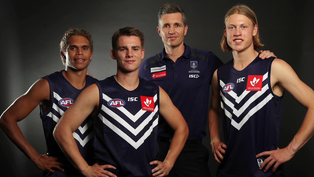 Fremantle coach Justin Longmuir with top-10 picks Liam Henry, Caleb Serong and Hayden Young. Picture: Michael Klein