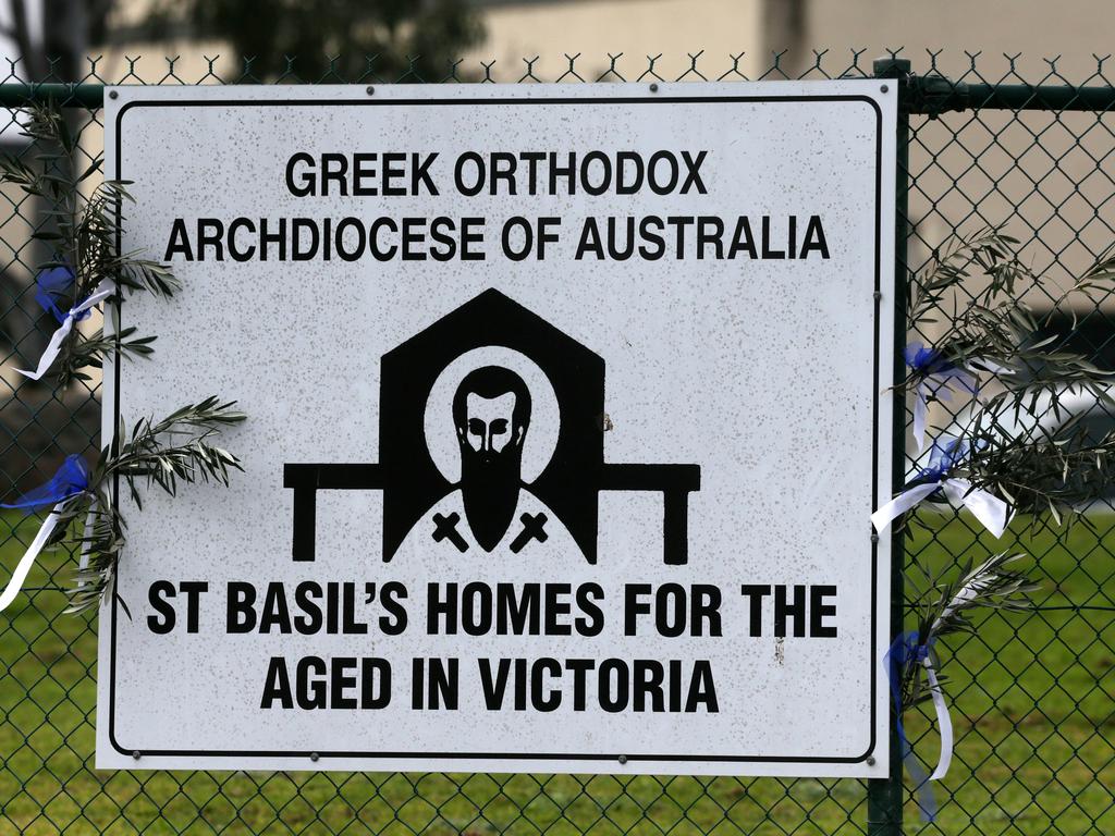 Flowers tied to the sign of the aged care centre. Picture: Sarah Matray