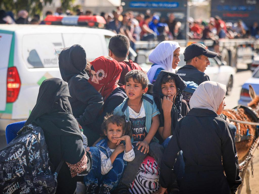 Palestinians with their belongings leave Gaza City as they flee from their homes following the Israeli army's warning to evacuate. Picture: Mahmud Hams/AFP