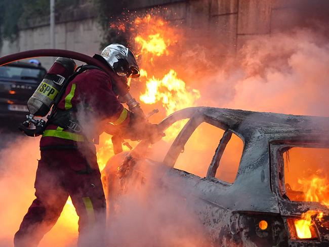 A firefighter at the scene of the riots in Nanterre, west of Paris. Picture: AFP