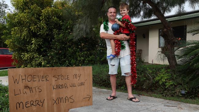 Andrew Tett with son Xavier Tett, 4, concerned by the damage and theft of their Christmas lights. Picture: Liam Kidston