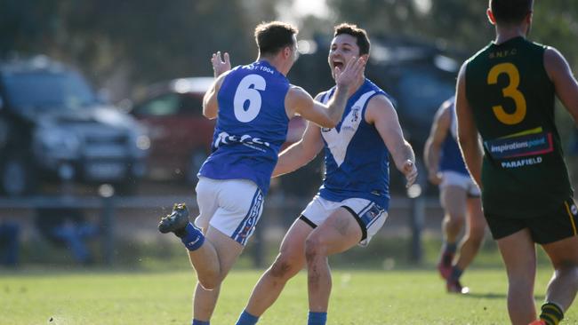 Athelstone’s Kyle Durdin celebrating with teammate Josh Schinella on Saturday. Picture: AAP/Morgan Sette