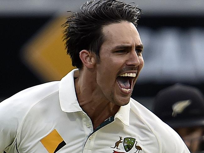 Australia's paceman Mitchell Johnson celebrates his wicket of New Zealand captain Brendon McCullum during day two of the first Test cricket match between Australia and New Zealand in Brisbane on November 6, 2015. AFP PHOTO / Saeed KHAN IMAGE STRICTLY RESTRICTED TO EDITORIAL USE - STRICTLY NO COMMERCIAL USE