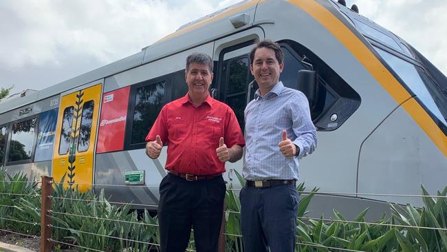 Maryborough MP Bruce Saunders and Fraser Coast mayor George Seymour welcome the arrival of an NGR train headed for repairs at Downer.