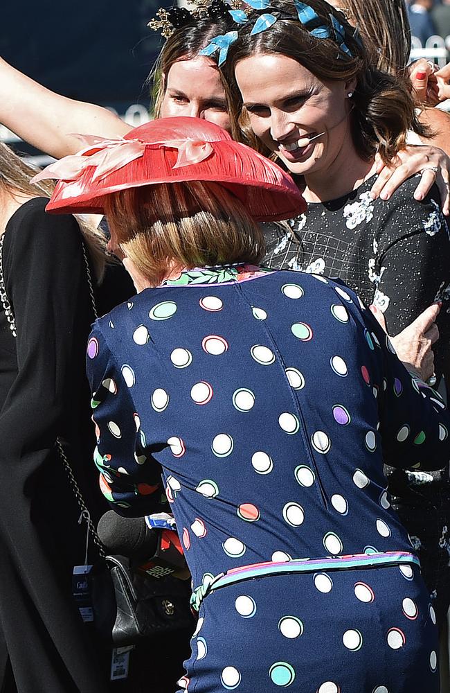 Trainer Gai Waterhouse pulls Francesca Cumani into a group photograph after taking out the Thousand Guineas with Global Glamour. Picture: AAP