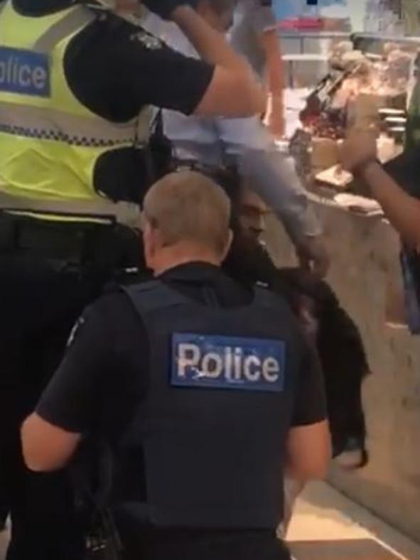 Footages shows police apprehending the person at Knox Shopping Centre. Picture: Urban Desi, Facebook.