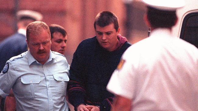 1993. Murderer Paul Denyer, being escorted by police. Pic Ex Melbourne General Victoria (Vic) / Police Picture: Photo File