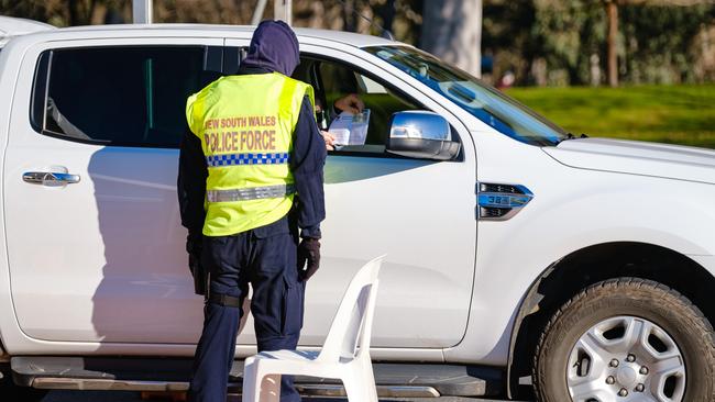 Wodonga Place Albury border checkpoint into NSW. Since midnight on Wednesday 8 July, police have facilitated the safe movement of more than 150,000 cars between Victoria and NSW. Picture: NCA NewsWire / Simon Dallinger