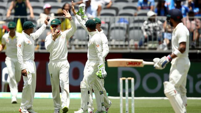 Cummins had Kohli controversially caught in the second Test. Picture: Getty